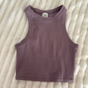 Size small purple cropped tank top. Never worn.
